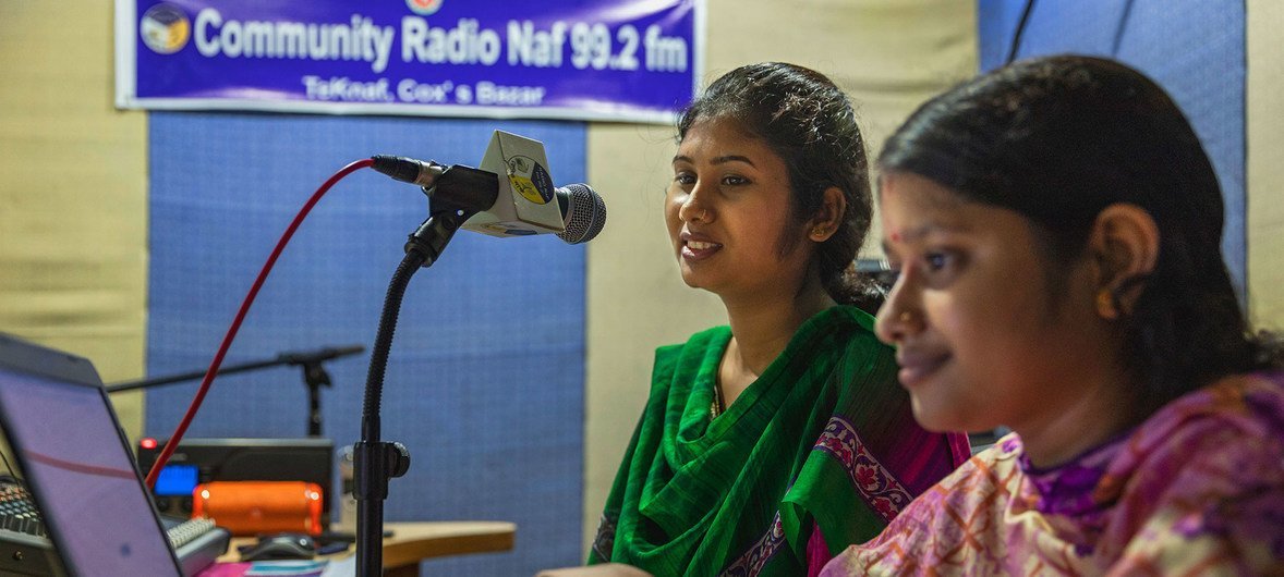 In Teknaf, Bangladesh, presenter Joya Pul Happy (left) and her producer Shanta Pul at the community radio, work on an upcoming show. (August 2018)