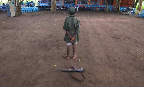 A child stands during a ceremony to release children from the ranks of armed groups and start a process of reintegration in Yambio, South Sudan.