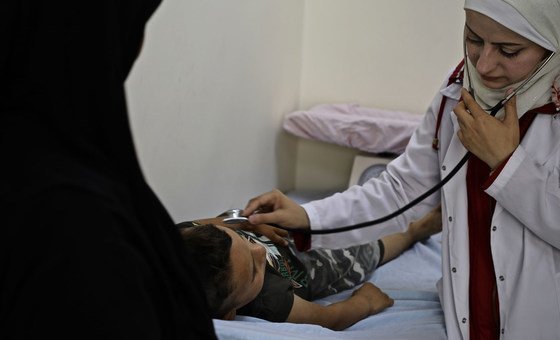 A paediatrician attends to a young boy suffering from malnutrition at the Sakhour health centre in Eastern Aleppo city. (file) 