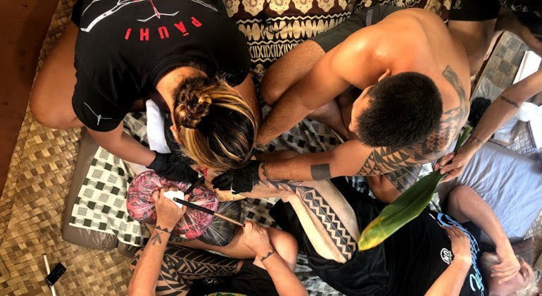 Keone Nunes (bottom, centre) brought the art of traditional tattooing back to Hawaii in the 1990s.