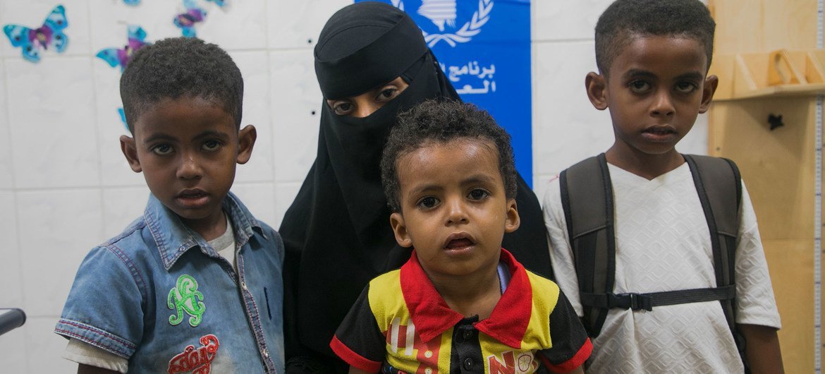 A mother brings her children for nutrition checks at a WFP-supported clinic in Aden, Yemen.
