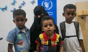 A mother brings her children for nutrition checks at a WFP-supported clinic in Aden, Yemen.