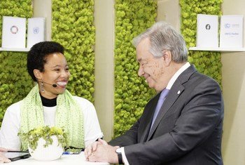 António Guterres talks COP25 climate action with youth activist Marie Christina Kolo from Madagascar at COP25 climate conference. 