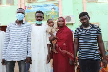 Relatives wait outside a hospital in Kassala, Sudan, where their 28-year-old sister is being treated for dengue fever. Like many Sudanese, due to the economic crisis, they struggle to pay for the treatment.