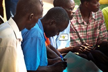 A community group meets in Uganda. 