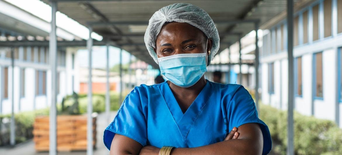 A nurse poses for a portrait in the Democratic Republic of the Congo during a COVID-19 vaccination campaign.