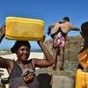 People draw water from a well built on Faux Cap's beach in Madagascar.