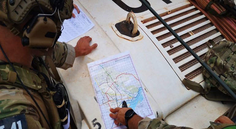 Portuguese UN peacekeepers plan their route while on patrol in the Central African Republic.