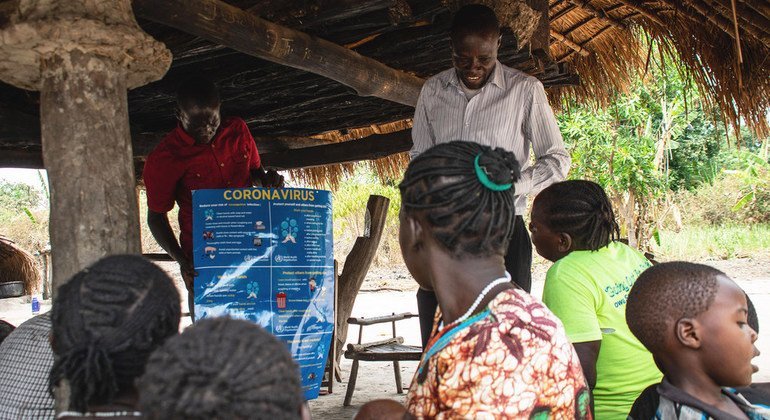 Villagers in South Sudan learn about the dangers of coronavirus from a UNICEF partner organization.