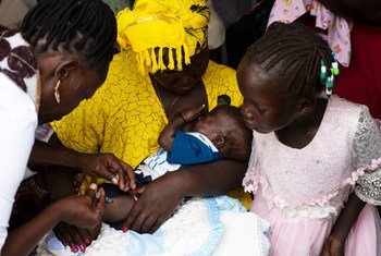 A 19-year old mother takes her three-month-old son to the Nyakuron primary health care centre in South Sudan’s capital Juba for a polio and penta vaccine. When he is old enough, she will also inoculate him against measles. 