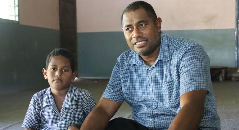 Orisi (right) and his 5-year old son, Semesa Francis Seniucidromo.
