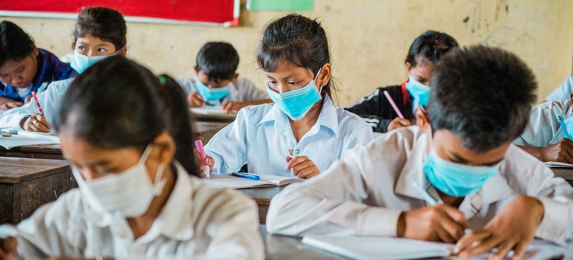 Students at a school in Cambodia are studying despite the COVID-19 pandemic. 