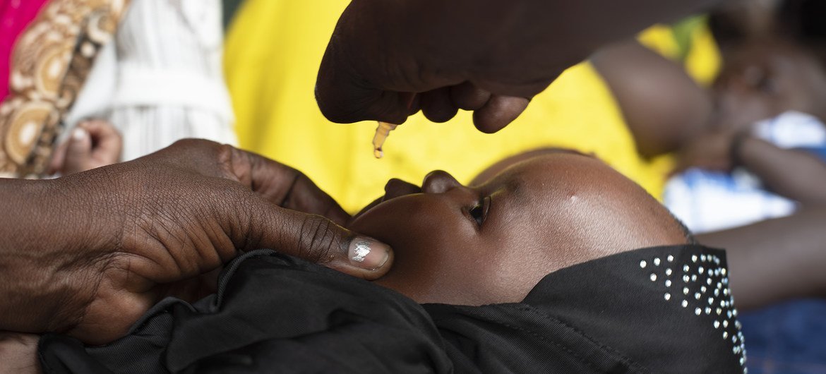 A young child is vaccinated against polio in Juba, South Sudan in March 2020.