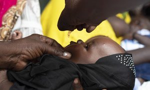 A young child is vaccinated against polio in Juba, South Sudan in March 2020.