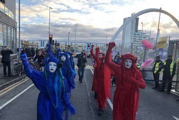 Protesters outside the COP26 Climate Conference site in Glasgow, Scotland.