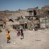 Children play in a neighbourhood ravaged by conflict in Iraq.