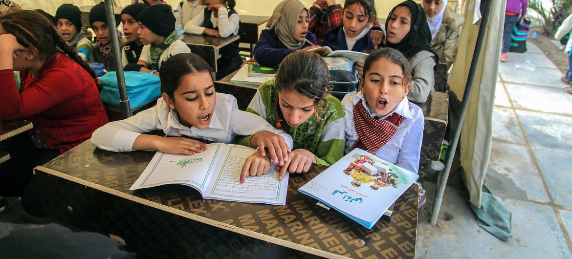 Displaced children in a classroom in Baghdad, Iraq.