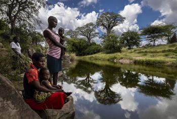 Local women gather at a river in Mucheni, Zimbabwe.