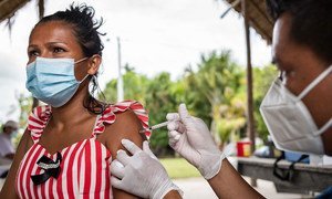 A woman is vaccinated against COVID-19 in the indigenous community of Concordia, Colombia.