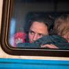 A mother and child leave Lviv's main train station in Ukraine.