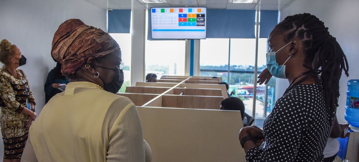 The Executive Director of the United Nations Population Fund, Dr. Natalia Kanem (left), takes a tour of the main office of the National Child Helpline in Dar es Salaam, Tanzania.