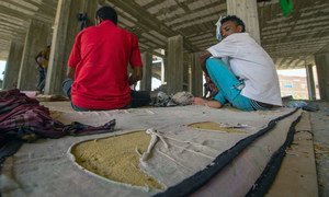 Migrants sleep in an abandoned, half-constructed building in Aden city, Yemen.