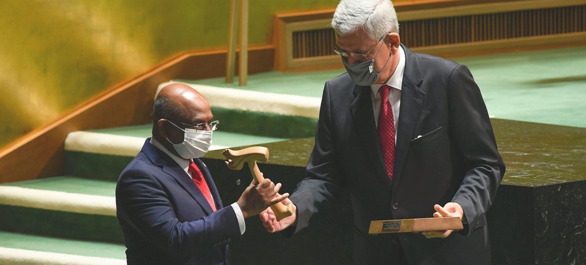 Volkan Bozkir (right), President of the 75th session of the UN General Assembly, hands the gavel over to Abdulla Shahid, President of the 76th session of the United Nations General Assembly.