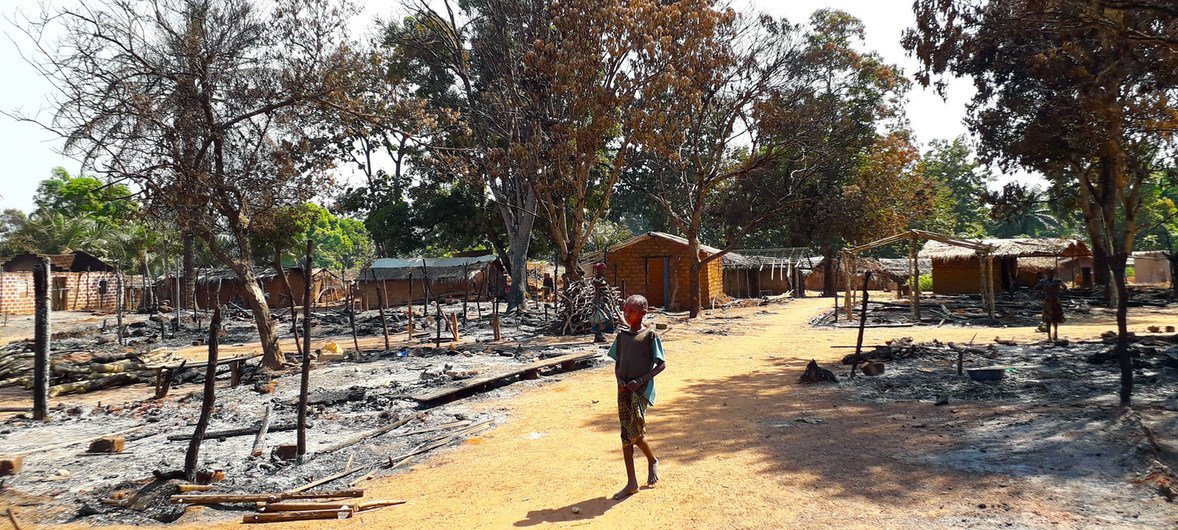 After armed clashes, a child walks among the charred ruins of Alindao, a city in the Central African Republic.