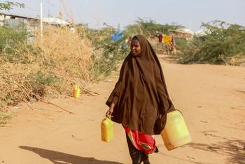 A woman collecting water in Kabasa camp for displaced People in Dolow, Somalia.