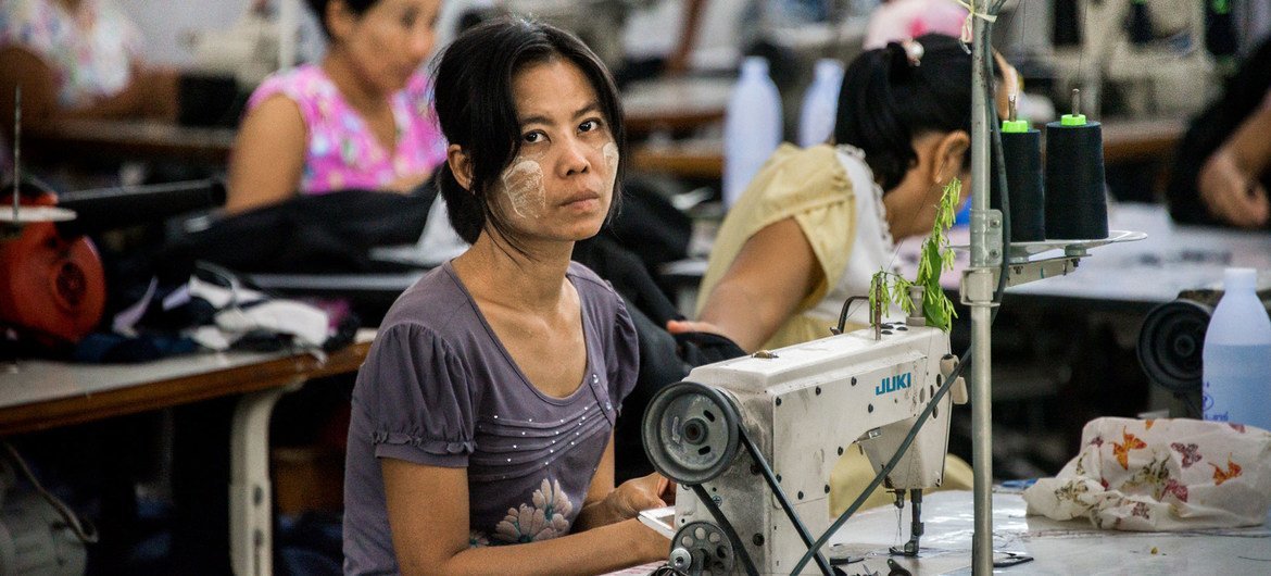 A migrant workers sew clothes in a factory in Thailand's western province of Mae Sot.