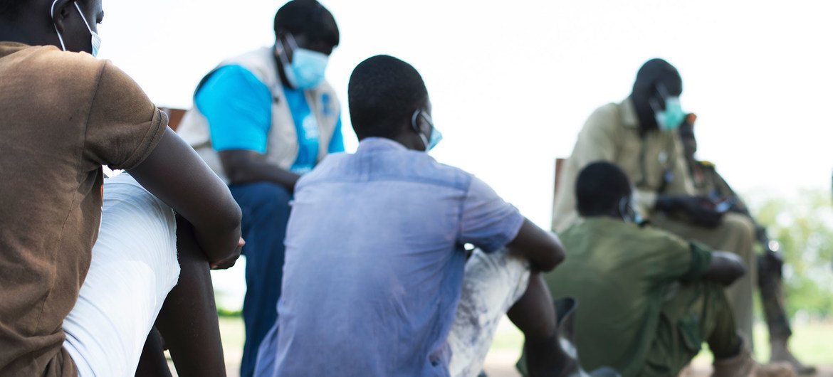 On 26 May 2020 in Juba, South Sudan, children released from armed forces are seated on the ground while negotiations for their reintegration take place.
