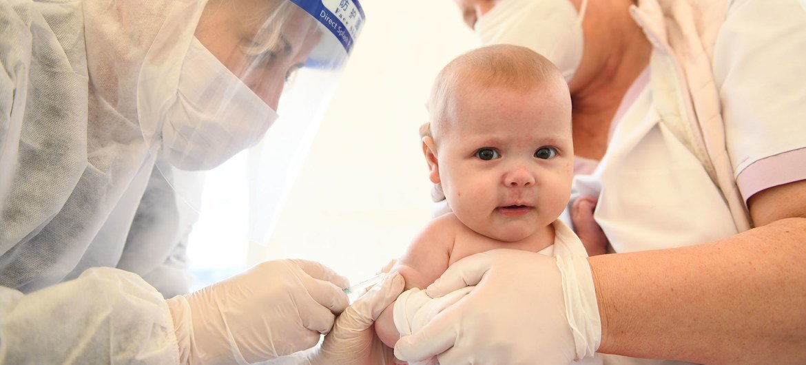 A little patient, held by two health workers, receives a routine vaccine in Kosovo. protect Protect health workers to save patients, WHO reiterates on World Patient Safety Day image1170x530cropped