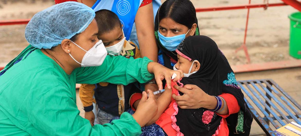 A four-year-old girl receives the measles-rubella (MR) vaccine at an immunization centre in Kathmandu, Nepal.