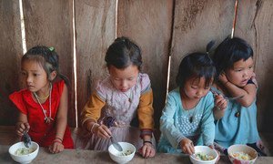 Rice porridge is served to children at an EU supported health outreach centre in Phongsaly Province, Lao PDR.