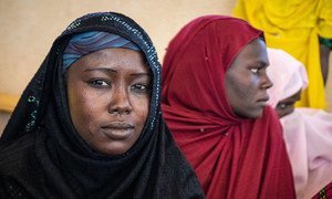 Two displaced women sit at a camp in Awaradi, Niger.