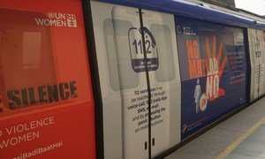 Marking the ‘Orange the World’ campaign in support of ending violence against women at Sultanpur Metro Station in New Delhi, India. 