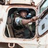 A Moroccan peacekeeper serving with MINUSCA sits in a UN armored vehicle on patrol in Bangassou, Central African Republic.