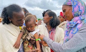 A young child is screened for malnutrition at a food distribution site in Tigray, northern Ethiopia.