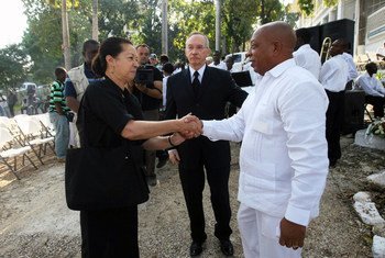 Former Haitian President Renee Preval (right), Edmond Mullet (center), Head of the UN Peacekeeping Mission in Haiti (MINUSTAH),  and Michelle Montas, MINUSTAH Spokesperson, attend the service marking the first of three days of mourning for those who died 