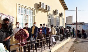 Migrants at the IOM Islam Qala Reception Centre. The Centre provided services to thousands of Afghan returnees daily, prior to the catastrophic fire on 13 February.