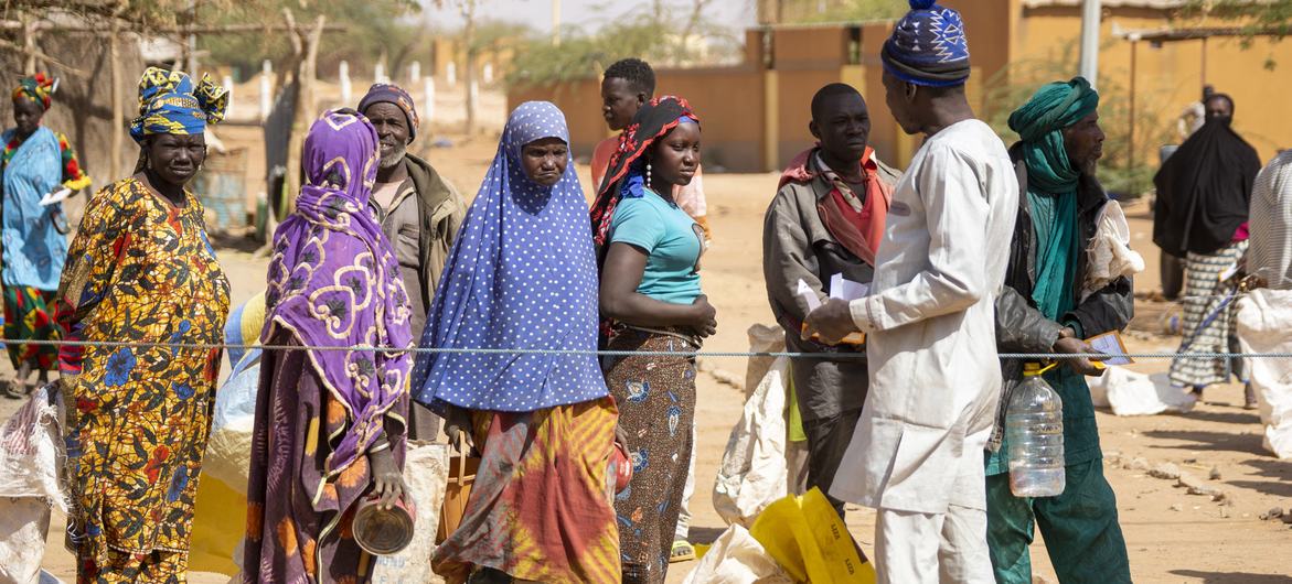 Displaced people wait in line for food distribution in Gorom-Gorom, Burkina Faso.