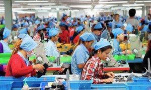 Workers at a footwear manufacturing plant in Cambodia. 