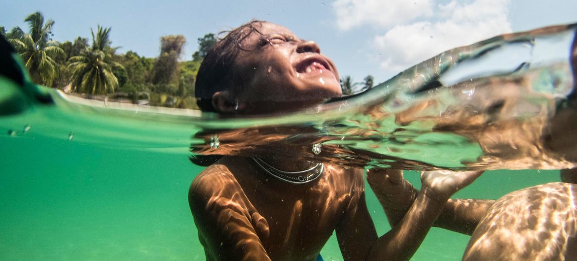 Moken children swim in the Myeik Islands in Myanmar.