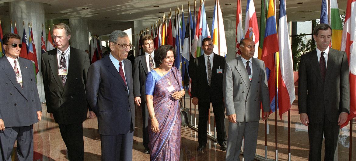 Nafis Sadik walks with Secretary-General Boutros Boutros-Ghali at the International Conference on Population and Development in Cairo, Egypt, 1994.