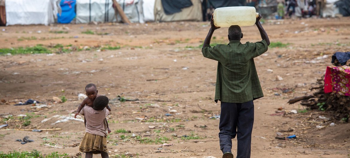 A man carries water close to Bujumbura in Burundi.