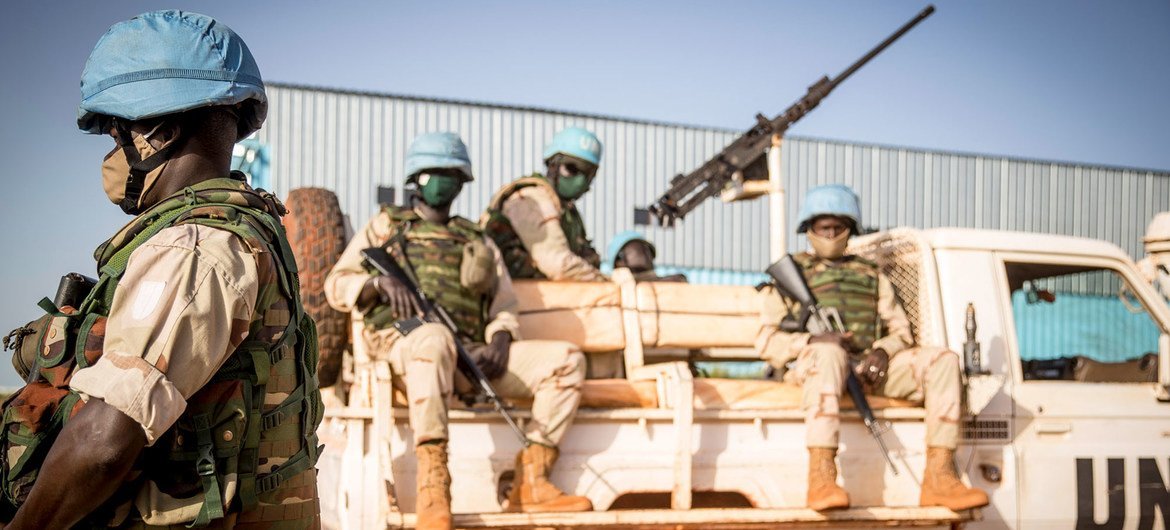 Peacekeepers serving with the UN's Multidimensional Integrated Stabilization Mission in Mali (MINUSMA) wear face masks while on patrol.