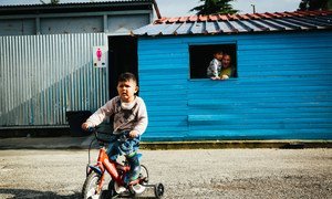 A young boy rides his bicycle inside the Kara Tepe accommodation site, on the Greek island of Lesvos.