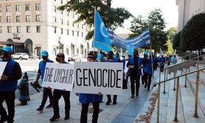 Protesters in Washington, DC, march against the alleged killing of Uyghur Muslims.