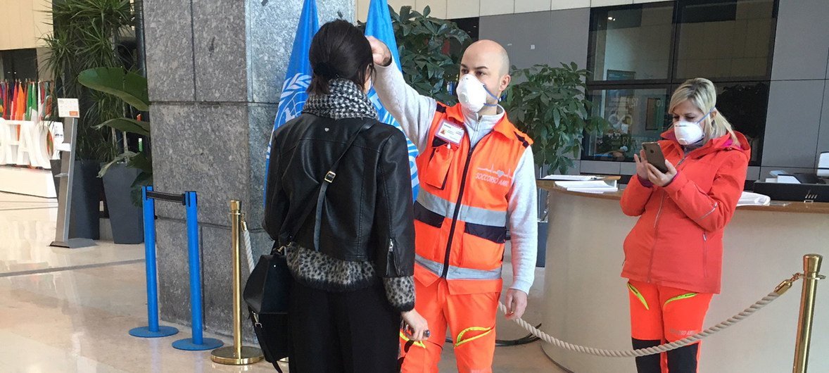Staff entering the FAO building in Rome are required to have their temperature checked. 