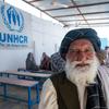An internally displaced person waiting for his turn to receive financial aid from UNHCR, in Afghanistan.
